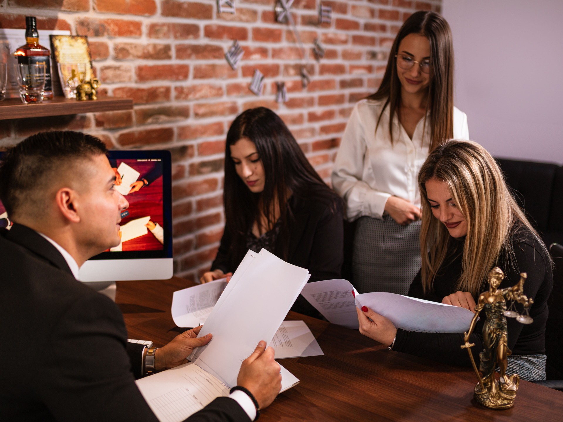 Lawyer Discussing Case with Clients at the Office