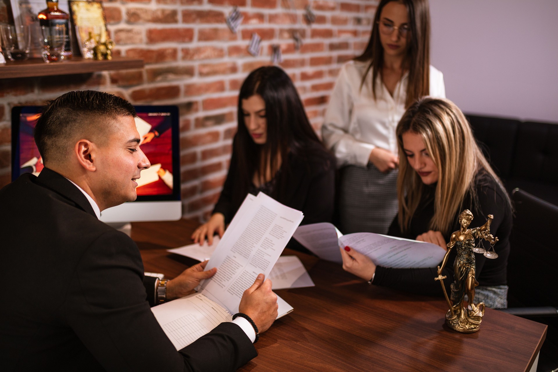 Lawyer Discussing Case with Clients at the Office